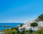 View of the bay and snow-white houses of the ancient city of Lindos on the Greek island of Rhodes, view of the Aegean Sea, the islands of the Dodecanese archipelago, Europe View of the bay and snow-white houses of the ancient city of Lindos on the Greek island of Rhodes, view of the Aegean Sea, the islands of the Dodecanese archipelago, Europe
