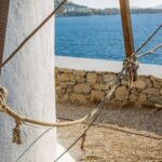 Selective focus shot of a lower part of a tower at the ocean in Mykonos, Greece