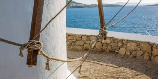 Selective focus shot of a lower part of a tower at the ocean in Mykonos, Greece