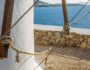 Selective focus shot of a lower part of a tower at the ocean in Mykonos, Greece Selective focus shot of a lower part of a tower at the ocean in Mykonos, Greece